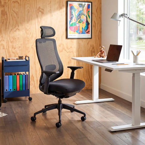 COLAMY ATLAS-01 Gray Executive Mesh Ergonomic Office Chair in a Bright Home Office with a Standing Desk