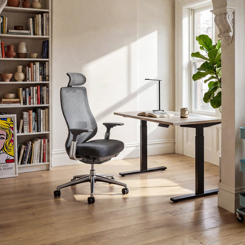 COLAMY ATLAS Gray High-Back Mesh Office Chair in a Bright Home Office with a Standing Desk and Bookshelf