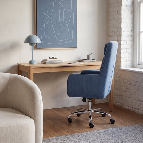 Rear view of the COLAMY COCOON Blue High-Load Cloud Comfort Swivel Office Chair positioned at a wooden desk in a modern home office